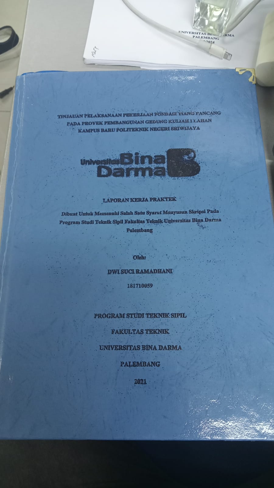 Cover PELAKSANAAN PEKERJAAN PONDASI TIANG PANCANG PROYEK PEMBANGUNAN GEDUNG KULIAH 1 LAHAN KAMPUS BARU POLITEKNIK NEGERI SRIWIJAYA